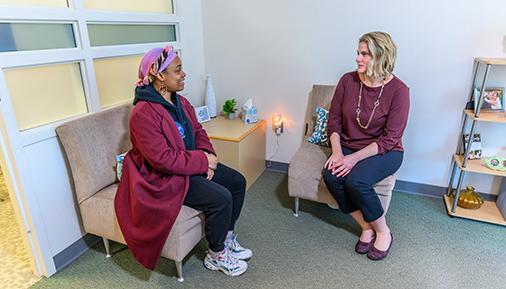 Counseling staff member with student